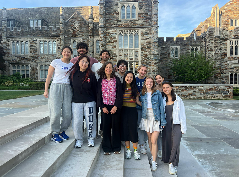 Duke professor Faulkner Fox and her students gather on the steps leading to Duke Chapel.