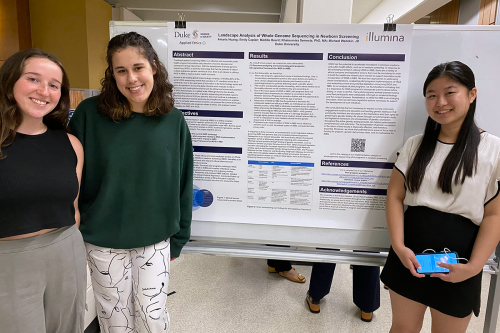 Three students in front of their Applied Ethics+ poster.